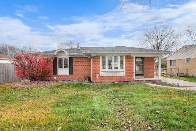 ranch-style home with a front yard