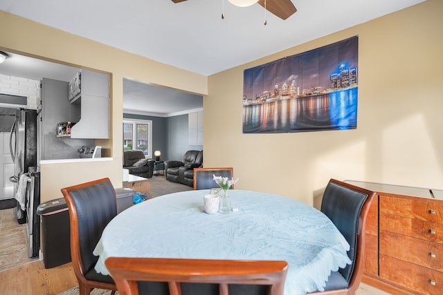 dining area featuring ceiling fan and light hardwood / wood-style floors