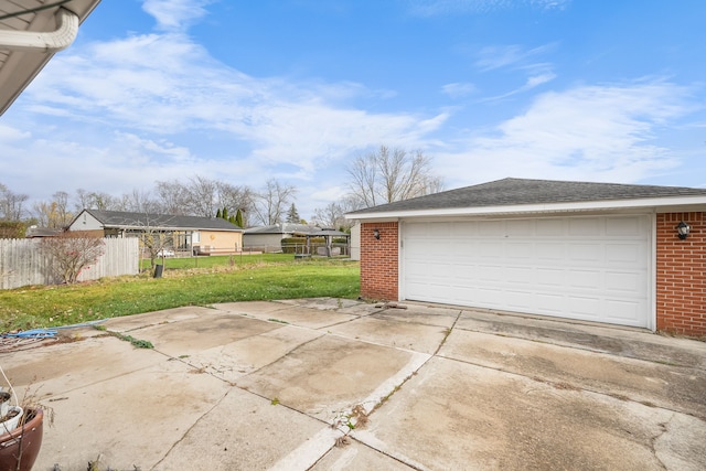 garage featuring a yard