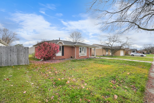 single story home with a garage and a front yard