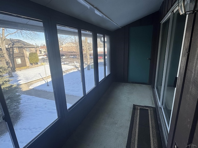 unfurnished sunroom with vaulted ceiling