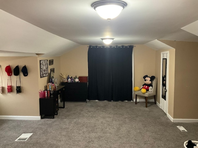 bonus room with vaulted ceiling and carpet