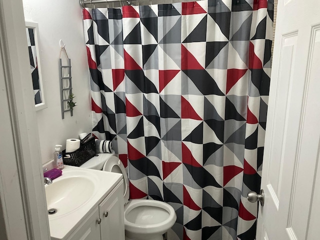 bathroom with vanity, a shower with curtain, and toilet