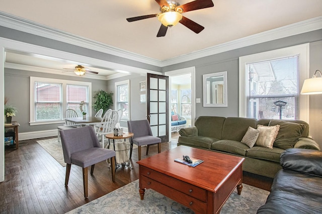 living room with crown molding, dark hardwood / wood-style floors, and ceiling fan