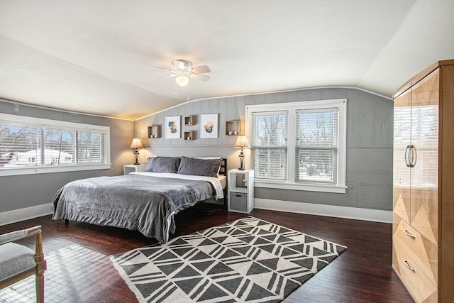 bedroom featuring ceiling fan, lofted ceiling, and dark hardwood / wood-style flooring