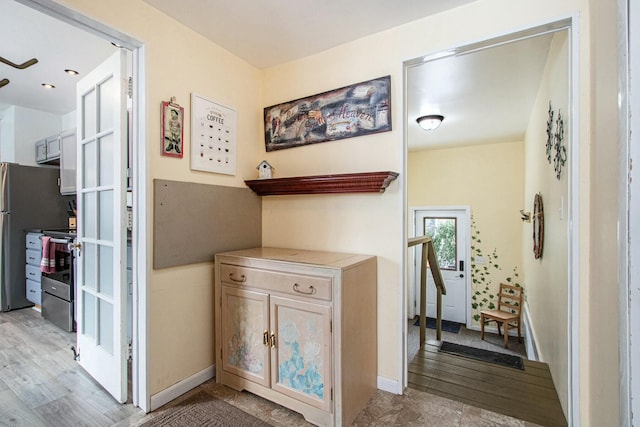 corridor with light hardwood / wood-style flooring