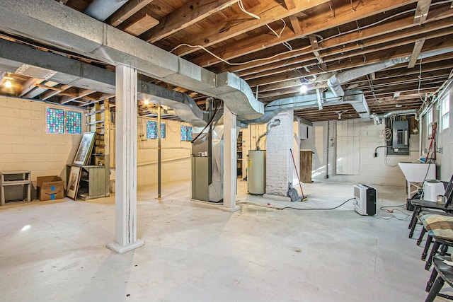 basement with gas water heater, heating unit, and electric panel