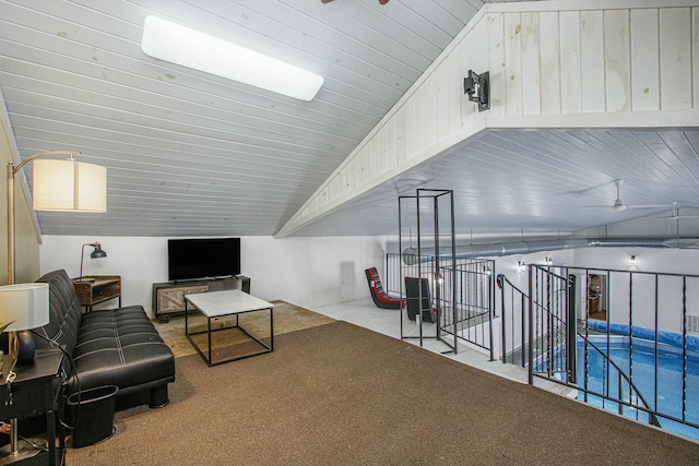 carpeted living room featuring lofted ceiling