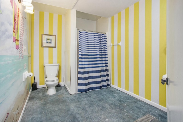 bathroom with a shower with curtain and toilet