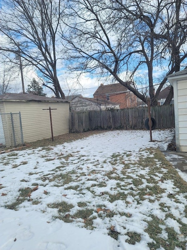 view of yard layered in snow