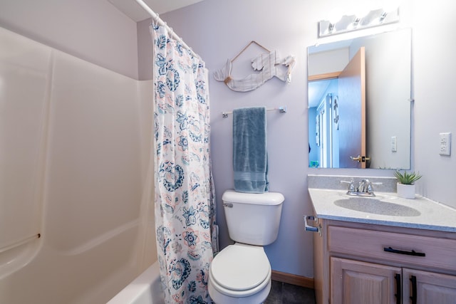 bathroom featuring toilet, shower / tub combo with curtain, and vanity