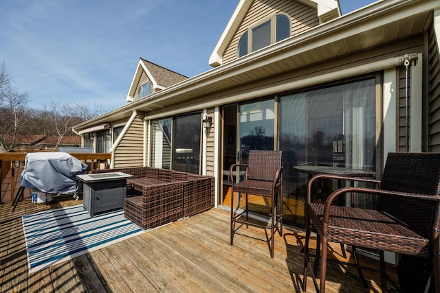 wooden deck with area for grilling