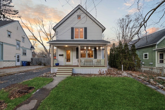 view of front facade featuring a yard and covered porch