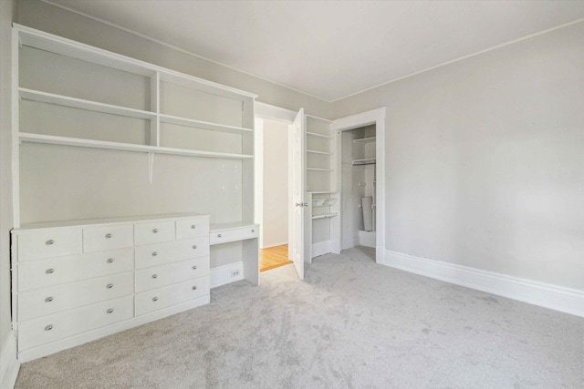 unfurnished bedroom with light colored carpet