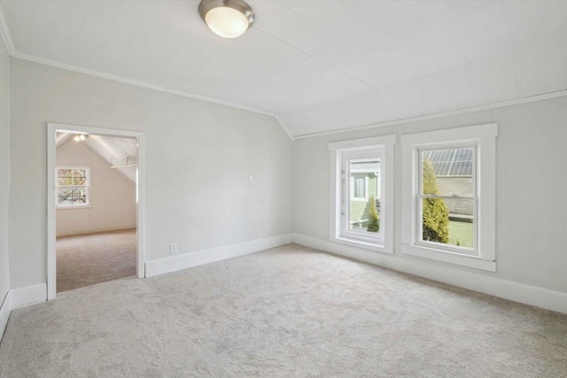 additional living space featuring lofted ceiling and light carpet