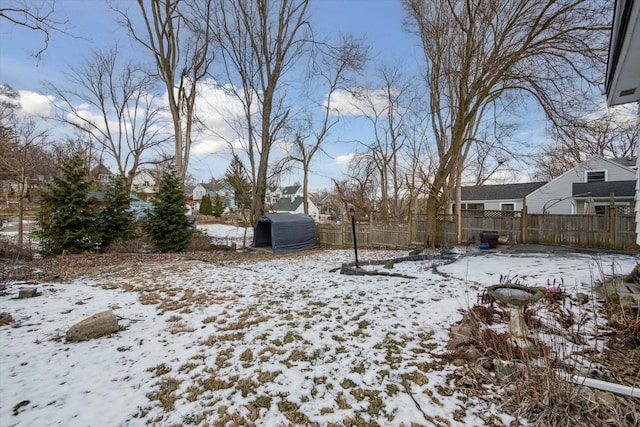 view of yard layered in snow