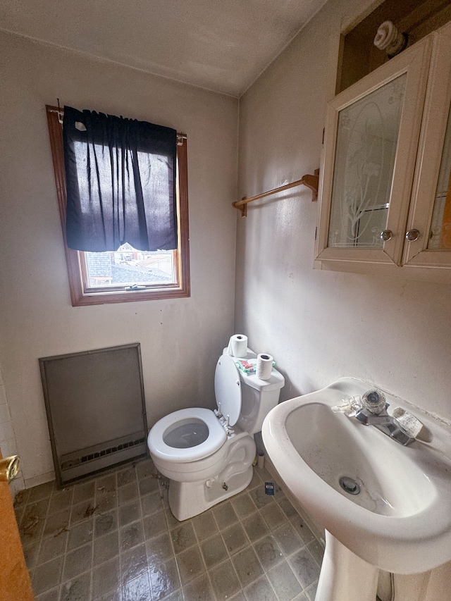 bathroom featuring sink and toilet