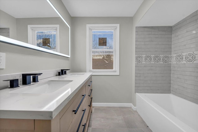 bathroom with vanity and a wealth of natural light