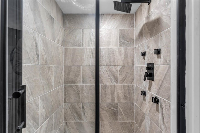 bathroom with a tile shower