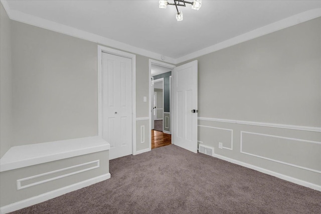 unfurnished bedroom featuring a closet and carpet