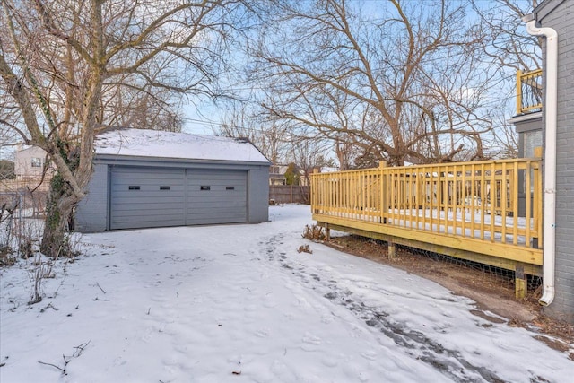 snowy yard featuring a deck