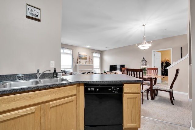 kitchen featuring light brown cabinetry, sink, hanging light fixtures, light carpet, and dishwasher