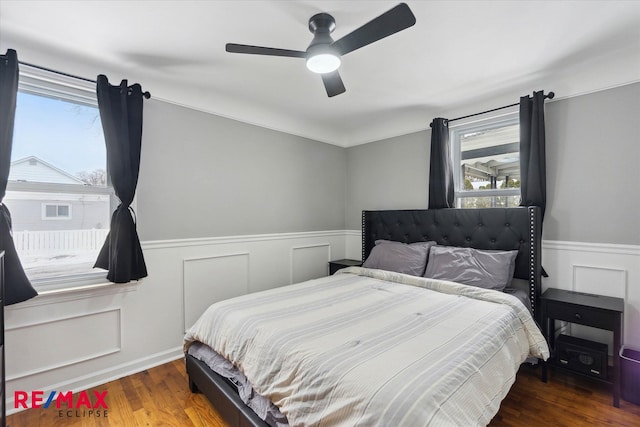 bedroom featuring ceiling fan and dark hardwood / wood-style flooring