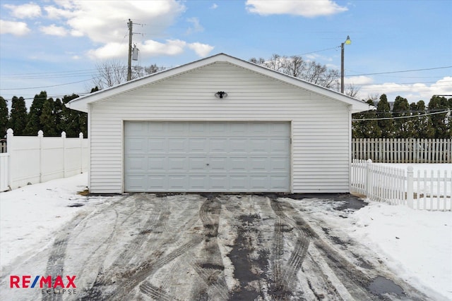 view of snow covered garage