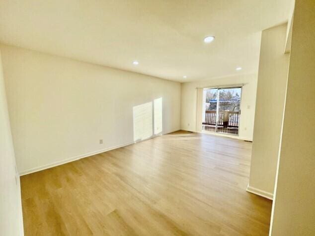 empty room with wood-type flooring