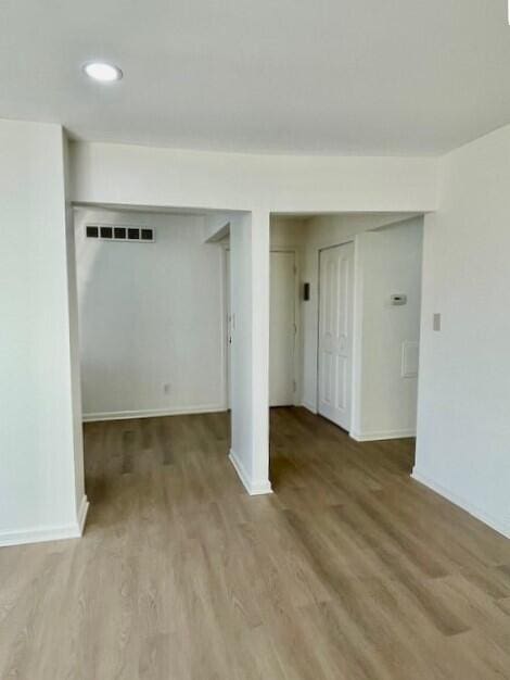 empty room featuring wood-type flooring