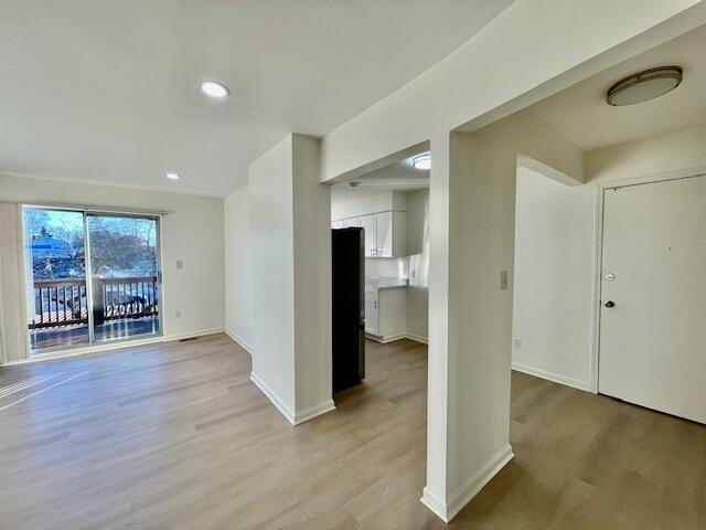 spare room featuring light hardwood / wood-style flooring