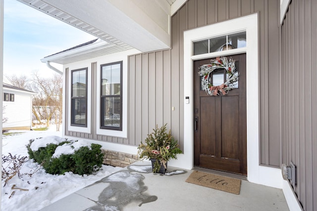 view of snow covered property entrance