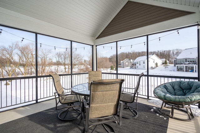 sunroom with lofted ceiling