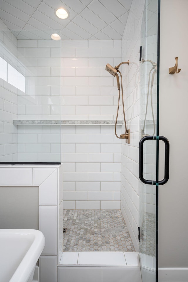 bathroom with sink and a shower with shower door