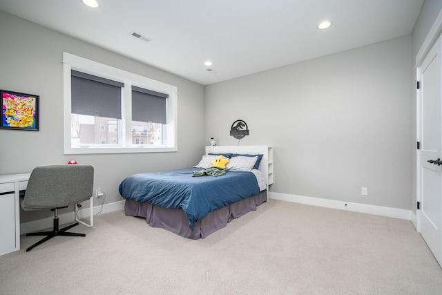 bedroom featuring light colored carpet