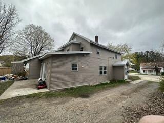 view of side of home with a patio area