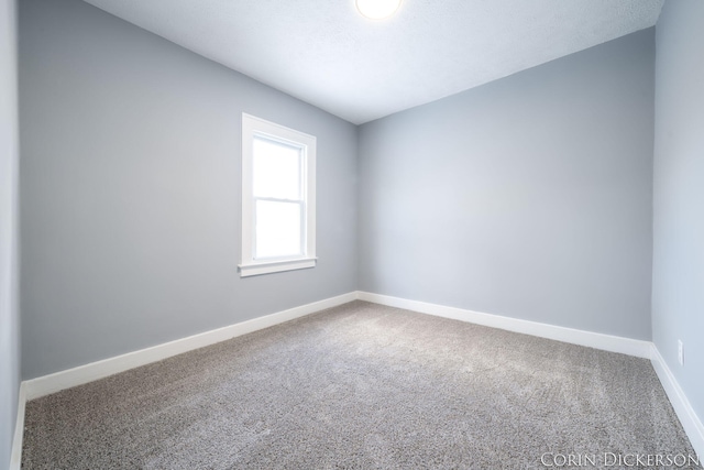 spare room with carpet flooring