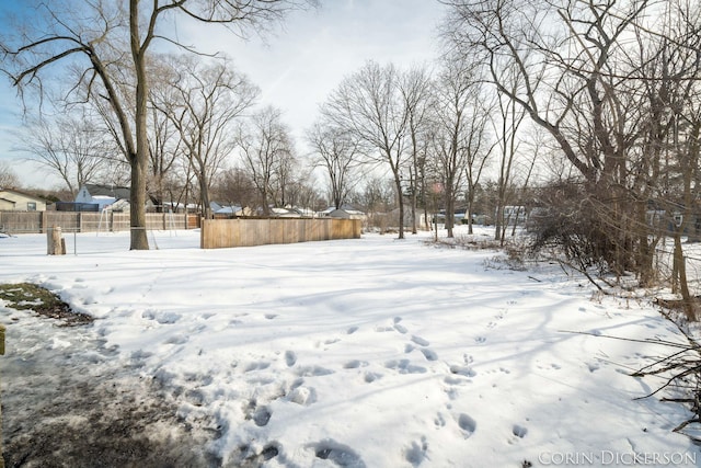 view of yard layered in snow