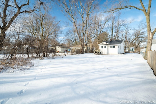 view of yard covered in snow