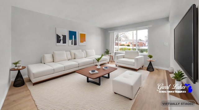 living room with light hardwood / wood-style flooring