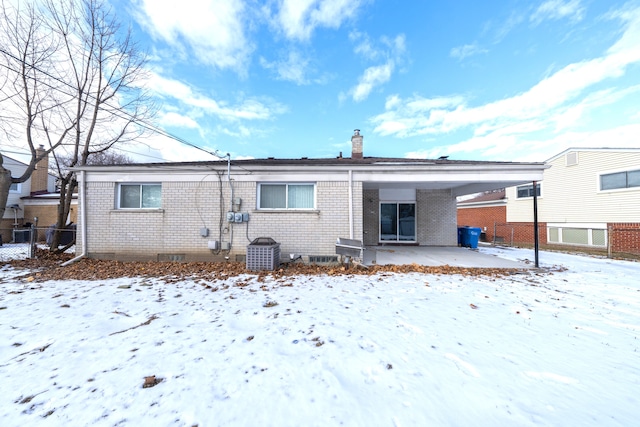 view of snow covered property