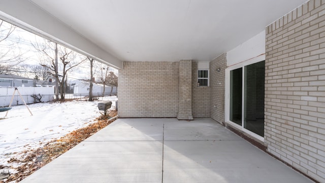 view of snow covered patio