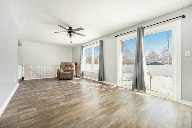 unfurnished room featuring hardwood / wood-style floors and ceiling fan