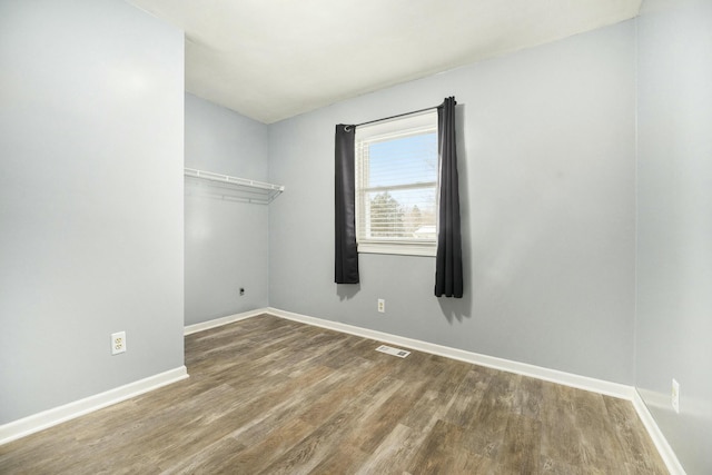 empty room featuring wood-type flooring