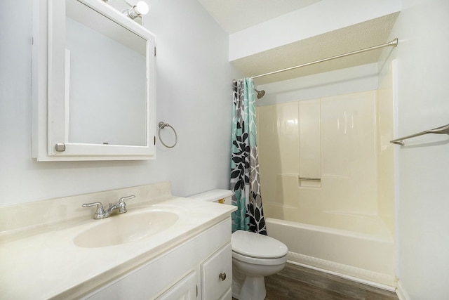 full bathroom featuring shower / tub combo with curtain, hardwood / wood-style floors, vanity, and toilet