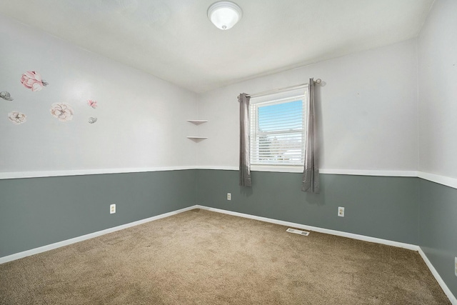 spare room featuring carpet flooring