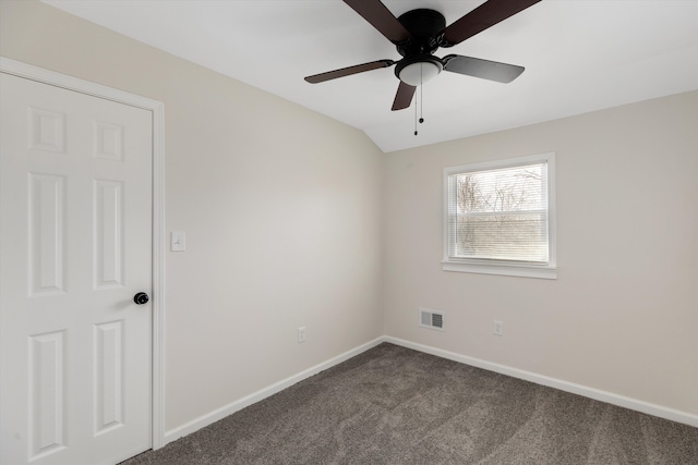 carpeted empty room with lofted ceiling and ceiling fan