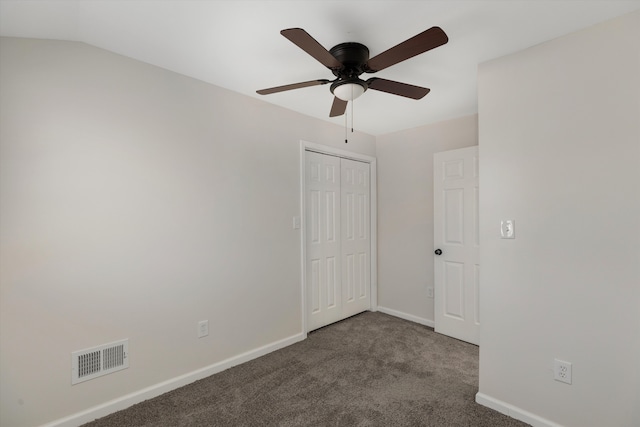 spare room featuring ceiling fan and carpet flooring