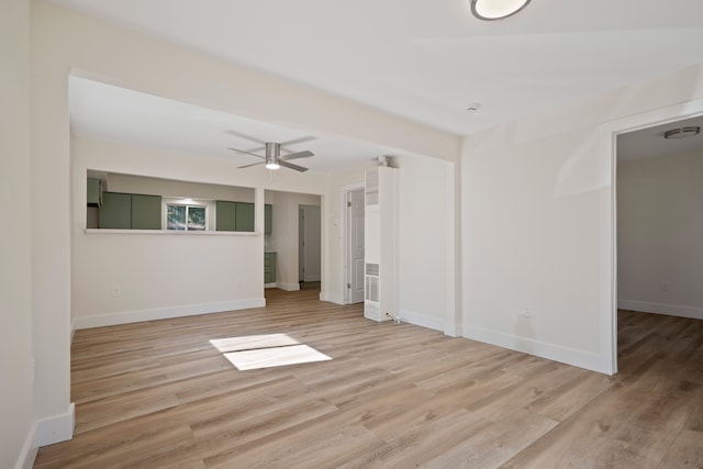 empty room featuring ceiling fan and light wood-type flooring