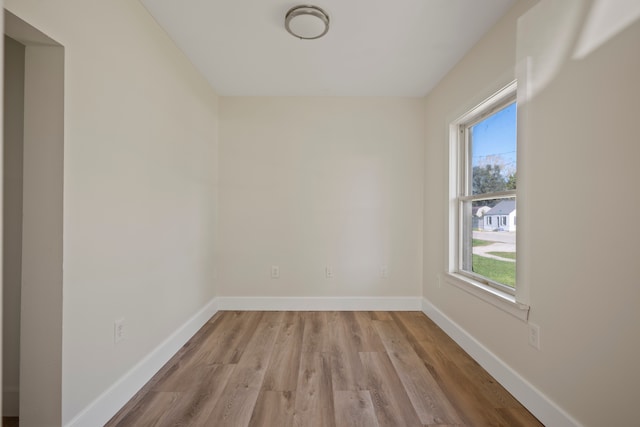 spare room featuring light wood-type flooring